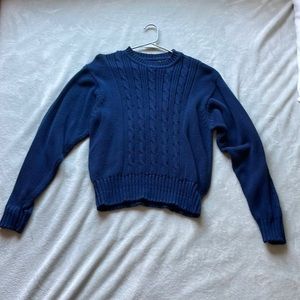 Navy winter sweater with woven design on front, snatched bottom hem. Large